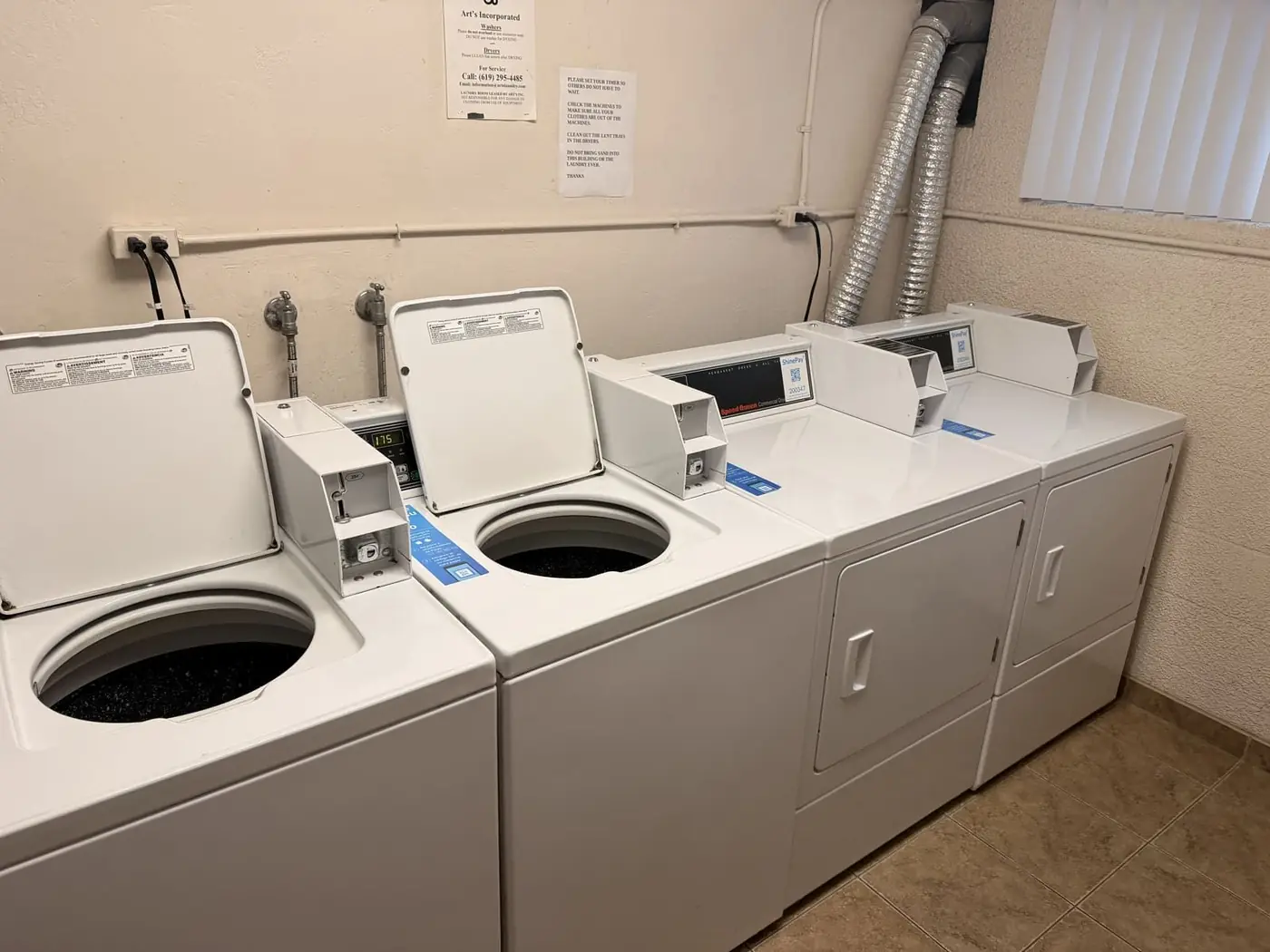 Row of clean commercial Speed Queen washers
